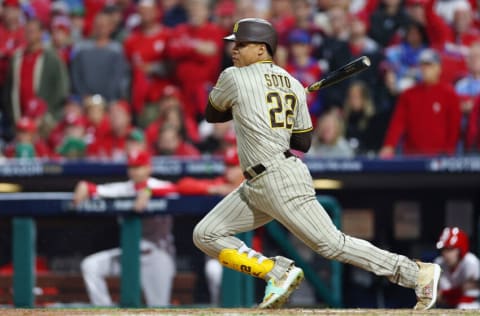 PHILADELPHIA, PENNSYLVANIA - OCTOBER 21: Juan Soto #22 of the San Diego Padres hits a single during the eighth inning against the Philadelphia Phillies in game three of the National League Championship Series at Citizens Bank Park on October 21, 2022 in Philadelphia, Pennsylvania. (Photo by Elsa/Getty Images)