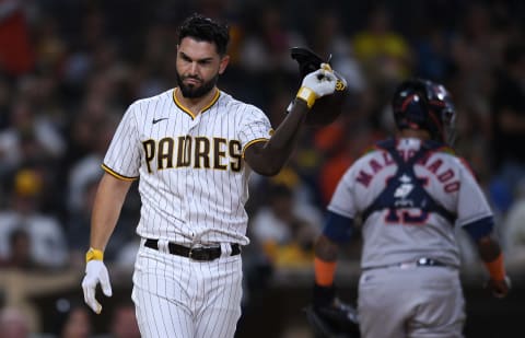 Sep 3, 2021; San Diego, California, USA; San Diego Padres first baseman Eric Hosmer (left) tosses his helmet after striking out to end the seventh inning against the Houston Astros at Petco Park. Mandatory Credit: Orlando Ramirez-USA TODAY Sports