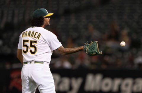 Sep 20, 2021; Oakland, California, USA; Oakland Athletics starting pitcher Sean Manaea (55) catches the ball during the third inning against the Seattle Mariners at RingCentral Coliseum. Mandatory Credit: Stan Szeto-USA TODAY Sports