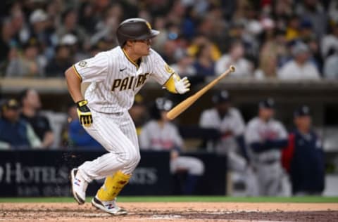 Apr 15, 2022; San Diego, California, USA; San Diego Padres shortstop Ha-seong Kim (7) hits an RBI single against the Atlanta Braves during the fifth inning at Petco Park. Mandatory Credit: Orlando Ramirez-USA TODAY Sports