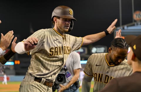 Oct 11, 2022; Los Angeles, California, USA; San Diego Padres right fielder Wil Myers (5) celebrates after hitting a home run during the fifth inning of game one of the NLDS for the 2022 MLB Playoffs against the Los Angeles Dodgers at Dodger Stadium. Mandatory Credit: Jayne Kamin-Oncea-USA TODAY Sports