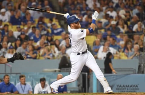 Sep 6, 2022; Los Angeles, California, USA; Los Angeles Dodgers third baseman Justin Turner (10) hits a single in the sixth inning against the San Francisco Giants at Dodger Stadium. Mandatory Credit: Richard Mackson-USA TODAY Sports