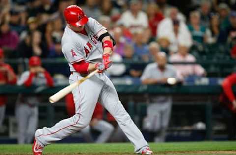 May 13, 2016; Seattle, WA, USA; Los Angeles Angels first baseman C.J. Cron (24) hits a two-run RBI single in the ninth inning against the Seattle Mariners at Safeco Field. The Angels won 7-6. Mandatory Credit: Jennifer Buchanan-USA TODAY Sports