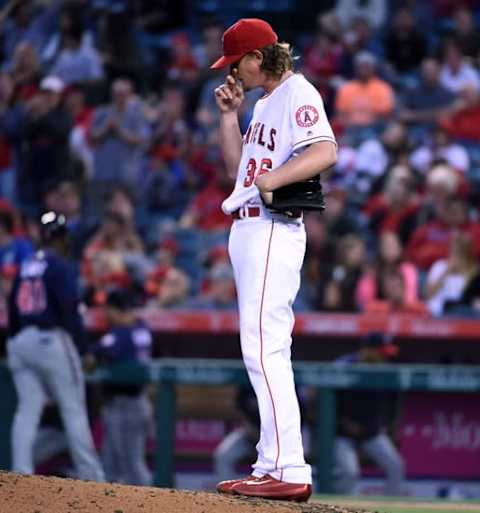 Jun 13, 2016; Anaheim, CA, USA; Los Angeles Angels starting pitcher Jered Weaver (36) reacts after surrendering a three-run home run in the third inning against the Minnesota Twins during a MLB game at Angel Stadium of Anaheim. Mandatory Credit: Kirby Lee-USA TODAY Sports