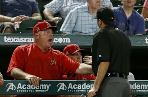 Sep 20, 2016; Arlington, TX, USA; Los Angeles Angels manager Mike Scioscia (14) yells at umpire Pat Hoberg (31) during the seventh inning against the Texas Rangers at Globe Life Park in Arlington.Texas won 5-4. Mandatory Credit: Tim Heitman-USA TODAY Sports