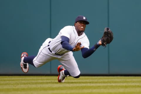 Aug 28, 2016; Detroit, MI, USA; in the sixth inning Detroit Tigers center fielder Cameron Maybin (4) tries to make a diving catch of a ball hit by Los Angeles Angels designated hitter Albert Pujols (not pictured) at Comerica Park. Mandatory Credit: Rick Osentoski-USA TODAY Sports