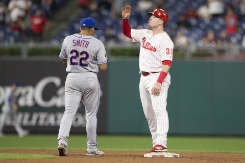 PHILADELPHIA, PA – SEPTEMBER 18: Justin Bour #33 of the Philadelphia Phillies reacts in front of Dominic Smith #22 of the New York Mets after hitting an RBI double in the bottom of the sixth inning at Citizens Bank Park on September 18, 2018 in Philadelphia, Pennsylvania. The Phillies defeated the Mets 5-2. (Photo by Mitchell Leff/Getty Images)