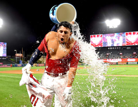 ANAHEIM, CA – SEPTEMBER 24: Jefry Marte #19 of the Los Angeles Angels of Anaheim pours a cooler of ice water on Jose Briceno #10 of the Los Angeles Angels of Anaheim after he hit a pinch hit walk off home run in the eleventh inning of the game against the Texas Rangers at Angel Stadium on September 24, 2018 in Anaheim, California. (Photo by Jayne Kamin-Oncea/Getty Images)