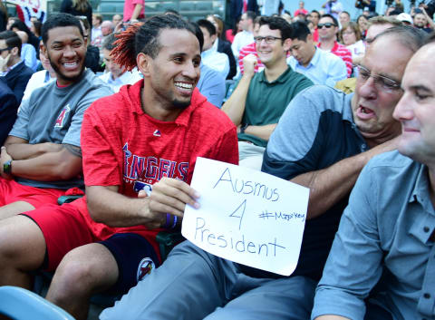 ANAHEIM, CA – OCTOBER 22: J.C. Ramirez #66 looks on as Keynan Middleton #39 of the Los Angeles Angels of Anaheim shows former player Clyde Wright his sign that says “Ausmus for President” during a press conference to introduce Brad Ausmus as the team’s new manager at Angel Stadium on October 22, 2018 in Anaheim, California. (Photo by Jayne Kamin-Oncea/Getty Images)