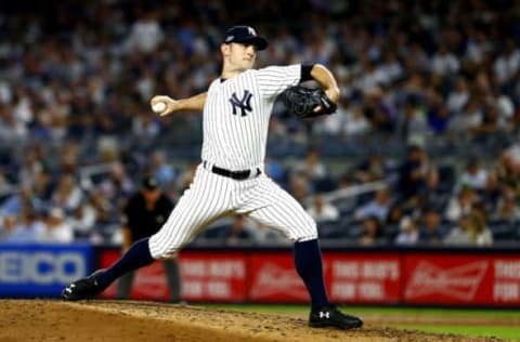 NEW YORK, NEW YORK – OCTOBER 09: David Robertson #30 of the New York Yankees throws a pitch against the Boston Red Sox during the sixth inning in Game Four of the American League Division Series at Yankee Stadium on October 09, 2018 in the Bronx borough of New York City. (Photo by Mike Stobe/Getty Images)