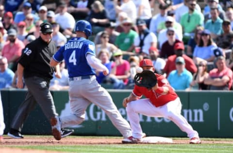 TEMPE, AZ – MARCH 01: Matt Thaiss #85 of the Los Angeles Angels of Anaheim waits for a throw from teammate Forrest Snow #70 as Alex Gordon #4 of the Kansas City Royals gets back to first base during a spring training game at Tempe Diablo Stadium on March 1, 2019 in Tempe, Arizona. (Photo by Norm Hall/Getty Images)