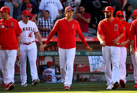 ANAHEIM, CA – APRIL 06: Shohei Ohtani #17 of the Los Angeles Angels of Anaheim walks on to the field from the dugout to shake hands with teammates after defeating the Texas Rangers at Angel Stadium of Anaheim on April 6, 2019 in Anaheim, California. (Photo by Jayne Kamin-Oncea/Getty Images)