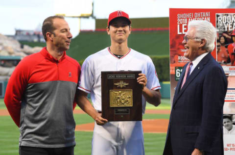 ANAHEIM, CA – APRIL 30: Shohei Ohtani #17 stands next to general manager Billy Eppler and team president Dennis Kuhl as he receives his America League Rookie of the Year award before the game against the Toronto Blue Jays at Angel Stadium of Anaheim on April 30, 2019 in Anaheim, California. (Photo by Jayne Kamin-Oncea/Getty Images)