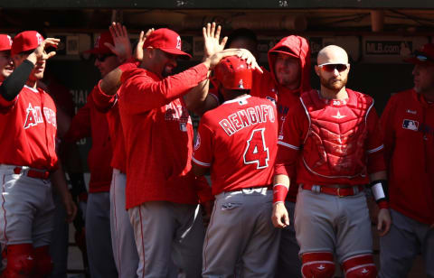 OAKLAND, CALIFORNIA – MAY 29: Luis Rengifo #4 of the Los Angeles Angels is congratulated by teammates after he scored in the ninth inning against the Oakland Athletics at Oakland-Alameda County Coliseum on May 29, 2019 in Oakland, California. (Photo by Ezra Shaw/Getty Images)