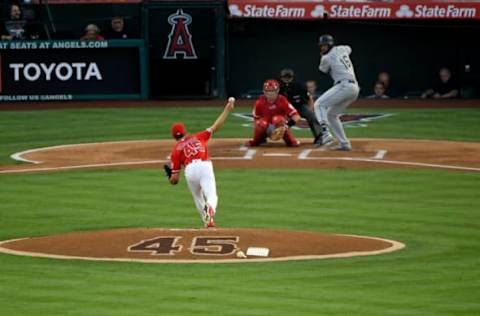 ANAHEIM, CA – JULY 12: Taylor Cole #45 of the Los Angeles Angels of Anaheim pitches to Domingo Santana #16 of the Seattle Mariners in the first inning at Angel Stadium of Anaheim on July 12, 2019 in Anaheim, California. All the Angels players wore Tyler Skaggs jersey #45 to honor him after his July 1 death. (Photo by John McCoy/Getty Images)