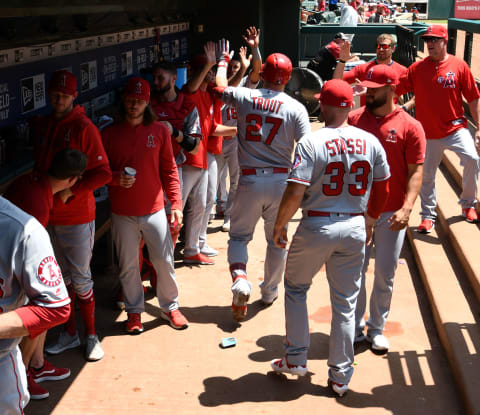 ARLINGTON, TEXAS – AUGUST 20: Mike Trout #27 of the Los Angeles Angels is congratulated by his teammates after his two-run home run in the top of the first inning during game one of a doubleheader against the Texas Rangers at Globe Life Park in Arlington on August 20, 2019 in Arlington, Texas. (Photo by C. Morgan Engel/Getty Images)