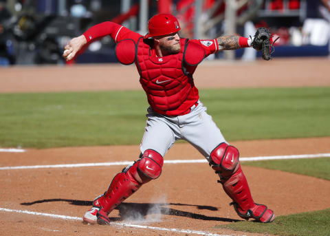 ATLANTA, GA – SEPTEMBER 30: Curt Casali #12 of the Cincinnati Reds throws to second in inning twelve of Game One of the National League Wild Card Series against the Atlanta Braves at Truist Park on September 30, 2020 in Atlanta, Georgia. (Photo by Todd Kirkland/Getty Images)