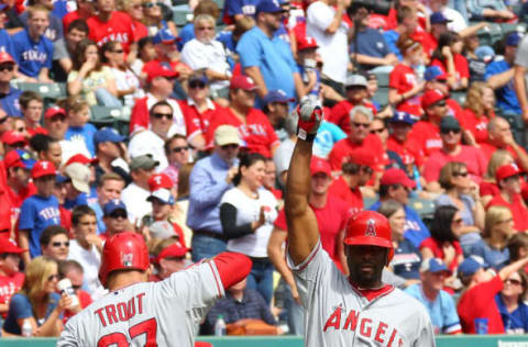 ARLINGTON, TX – SEPTEMBER 30: Torii Hunter #48 of the Los Angeles Angels of Anaheim congratulates Mike Trout #27 for a solo home run in game one of the double header against the Texas Rangers at Rangers Ballpark in Arlington on September 30, 2012 in Arlington, Texas. (Photo by Rick Yeatts/Getty Images)