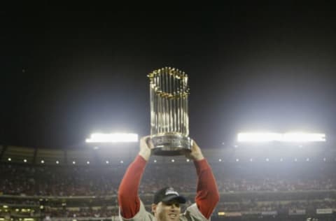 ANAHEIM, CA – OCTOBER 27: Tim Salmon #15 of the Anaheim Angels lifts the World Series trophy during the celebration after winning game seven of the World Series against the San Francisco Giants at Edison Field in Anaheim, California on October 27, 2002. The Angels won the title against the Giants on a 4-1 score, for the franchise’s first championship in 42 years. (Photo by Jed Jacobsohn /Getty Images)