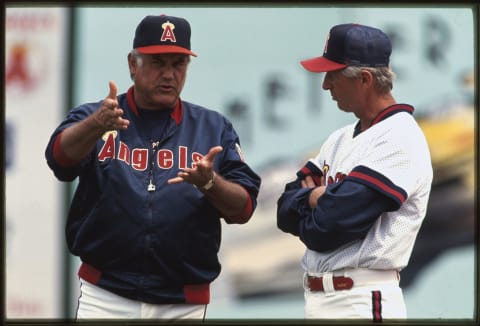 Anaheim, CA – 1990s: California Angels Manager Buck Rodgers talks to a a member of the Angels at Anaheim Stadium in Anaheim, California. Buck Rodgers managed the Angels from 1991-1994. (Photo by Angels Baseball LP/Getty Images)