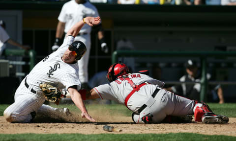 CHICAGO – MAY 30: Chris Widger #36 of the Chicago White Sox is tagged out at home plate by Bengie Molina #1 of the Los Angeles Angels of Anaheim in the fourth inning on May 30, 2005 at U.S. Cellular Field in Chicago, Illinois. (Photo by Jonathan Daniel/Getty Images)