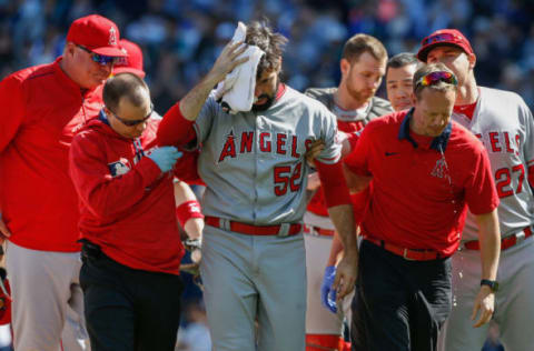 SEATTLE, WA – SEPTEMBER 04: Starting pitcher Matt Shoemaker #52 of the Los Angeles Angels of Anaheim is helped off the field after being hit in the head with a batted ball off the bat of Kyle Seager of the Seattle Mariners in the second inning at Safeco Field on September 4, 2016 in Seattle, Washington. (Photo by Otto Greule Jr/Getty Images)