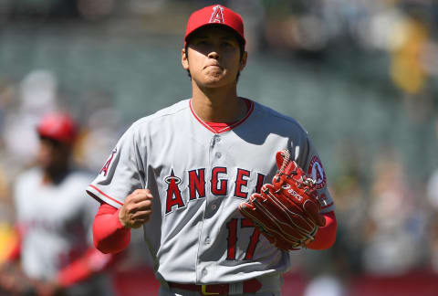 OAKLAND, CA – APRIL 01: Shohei Ohtani #17 of the Los Angeles Angels of Anaheim walks off the mound and reacts after striking out Marcus Semien #10 of the Oakland Athletics for the final out of the fifth inning of a Major League baseball game at Oakland Alameda Coliseum on April 1, 2018 in Oakland, California. (Photo by Thearon W. Henderson/Getty Images)