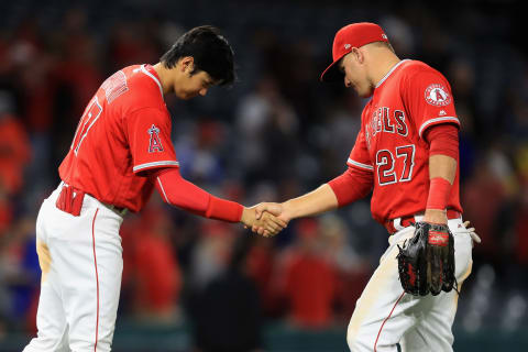 ANAHEIM, CA – MAY 10: Shohei Ohtani #17 shakes hands with Mike Trout #27 of the Los Angeles Angels of Anaheim after defeating the Minnesota Twins 7-4 in a game at Angel Stadium on May 10, 2018 in Anaheim, California. (Photo by Sean M. Haffey/Getty Images)