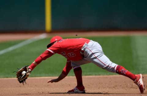 OAKLAND, CA – JUNE 16: David Fletcher #6 of the Los Angeles Angels of Anaheim reacts to field a groound ball hit down the line taking a hit away from Jed Lowrie #8 of the Oakland Athletics in the bottom of the first inning at the Oakland Alameda Coliseum on June 16, 2018 in Oakland, California. (Photo by Thearon W. Henderson/Getty Images)