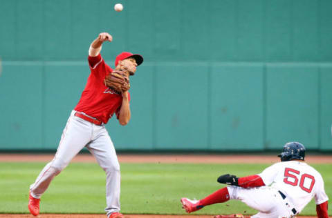 BOSTON, MA – JUNE 27: Andrelton Simmons #2 of the Los Angeles Angels turns a double play over the slide of Mookie Betts #50 of the Boston Red Sox in the first inning of a game at Fenway Park on June 27, 2018 in Boston, Massachusetts. (Photo by Adam Glanzman/Getty Images)