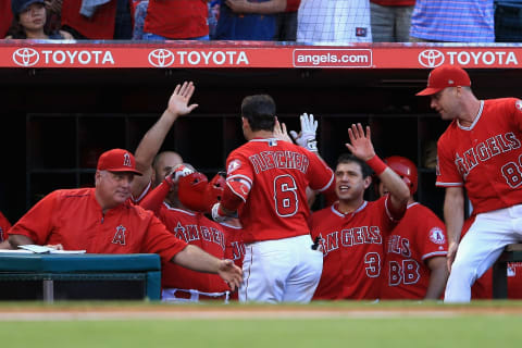 ANAHEIM, CA – JULY 12: Manager Mike Scioscia, Ian Kinsler #3 and Albert Pujols #5 congratulate David Fletcher #6 of the Los Angeles Angels of Anaheim after his solo homerun during the first nning of a game against the Seattle Mariners at Angel Stadium on July 12, 2018 in Anaheim, California. (Photo by Sean M. Haffey/Getty Images)