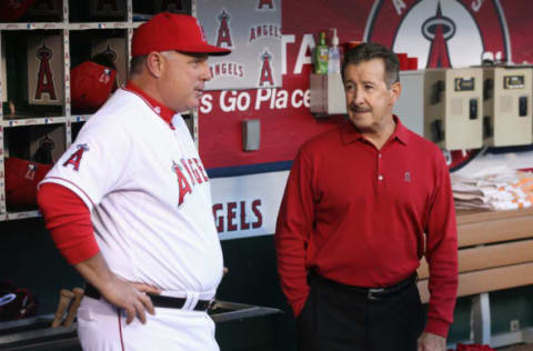 ANAHEIM, CA – APRIL 09: Los Angeles Angels of Anaheim owner Arte Moreno (R) talks with manager Mike Scioscia prior to the start of the home opener against the Oakland Athletics at Angel Stadium of Anaheim on April 9, 2013 in Anaheim, California. (Photo by Jeff Gross/Getty Images)