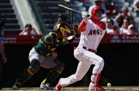 ANAHEIM, CA – SEPTEMBER 30: Shohei Ohtani #17 of the Los Angeles Angels of Anaheim strikes out swinging as catcher Beau Taylor #46 of the Oakland Athletics looks for the ball during the sixth inning of the MLB game at Angel Stadium on September 30, 2018 in Anaheim, California. Ohtani struck out swinging. (Photo by Victor Decolongon/Getty Images)