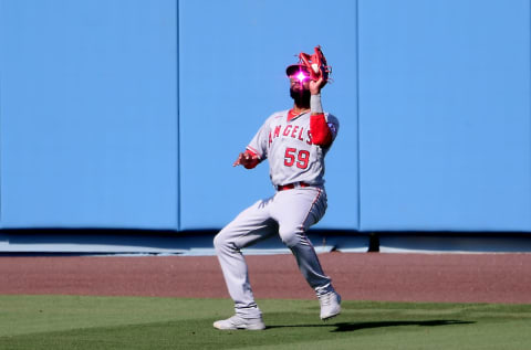 Sep 27, 2020; Los Angeles, California, USA; Los Angeles Dodgers catcher Austin Barnes (15) flies out to Los Angeles Angels center fielder Jo Adell (59) in the sixth inning of the game at Dodger Stadium. Mandatory Credit: Jayne Kamin-Oncea-USA TODAY Sports