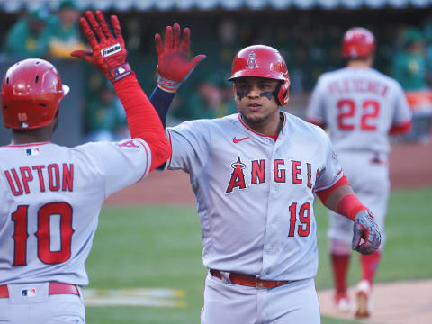 Los Angeles Angels center fielder Juan Lagares (19) high fives left fielder Justin Upton (10) after hitting a home run against the Oakland Athletics. Mandatory Credit: Kelley L Cox-USA TODAY Sports