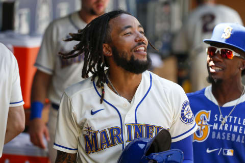 Jul 25, 2021; Seattle, Washington, USA; Seattle Mariners shortstop J.P. Crawford (3) celebrates in the dugout after scoring a run against the Oakland Athletics during the third inning at T-Mobile Park. Mandatory Credit: Joe Nicholson-USA TODAY Sports