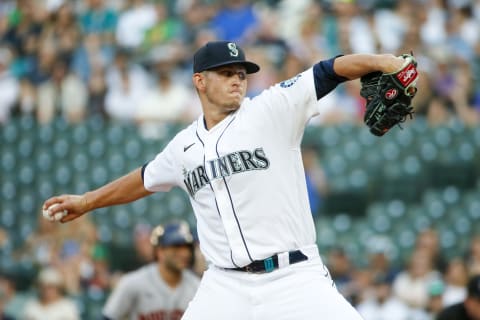 Jul 27, 2021; Seattle, Washington, USA; Seattle Mariners starting pitcher Chris Flexen (77) throws against the Houston Astros during the first inning at T-Mobile Park. Mandatory Credit: Joe Nicholson-USA TODAY Sports