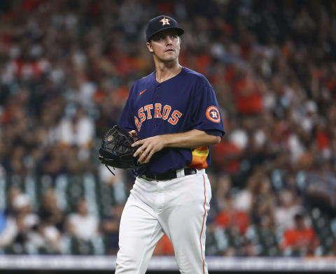 Oct 3, 2021; Houston, Texas, USA; Houston Astros relief pitcher Zack Greinke (21) walks off the mound after getting a strikeout during the seventh inning against the Oakland Athletics at Minute Maid Park. Mandatory Credit: Troy Taormina-USA TODAY Sports