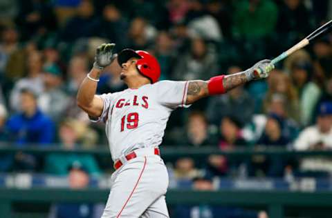 May 2, 2017; Seattle, WA, USA; Los Angeles Angels first baseman Jefry Marte (19) hits an RBI sacrifice fly against the Seattle Mariners during the fifth inning at Safeco Field. Mandatory Credit: Joe Nicholson-USA TODAY Sports