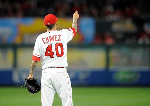 May 5, 2017; Anaheim, CA, USA; Los Angeles Angels starting pitcher Jesse Chavez (40) acknowledges to center fielder Mike Trout (27) his catch off a hit by Houston Astros center fielder George Springer (4) in the sixth inning at Angel Stadium of Anaheim. Mandatory Credit: Gary A. Vasquez-USA TODAY Sports