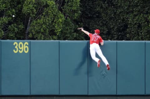 June 1, 2017; Anaheim, CA, USA; Los Angeles Angels center fielder Shane Robinson (17) goes after a home run hit by Minnesota Twins third baseman Miguel Sano (22) in the second inning at Angel Stadium of Anaheim. Mandatory Credit: Gary A. Vasquez-USA TODAY Sports