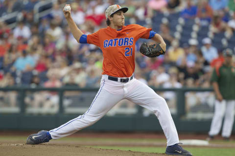 Jun 17, 2015; Omaha, NE, USA; Florida Gators pitcher Alex Faedo (21) throws the ball against the Miami Hurricanes in the first inning 2015 College World Series at TD Ameritrade Park. Mandatory Credit: Bruce Thorson-USA TODAY Sports