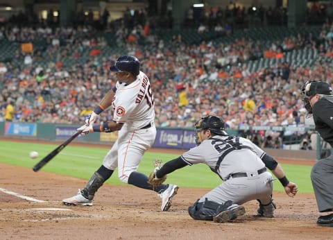 Jul 25, 2016; Houston, TX, USA; Houston Astros first baseman Luis Valbuena (18) hits a single against the New York Yankees in the second inning at Minute Maid Park. Mandatory Credit: Thomas B. Shea-USA TODAY Sports