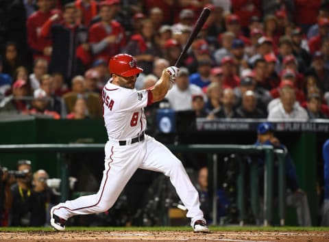 Oct 13, 2016; Washington, DC, USA; Washington Nationals shortstop Danny Espinosa (8) hits an RBI single against the Los Angeles Dodgers during the second inning during game five of the 2016 NLDS playoff baseball game at Nationals Park. Mandatory Credit: Brad Mills-USA TODAY Sports