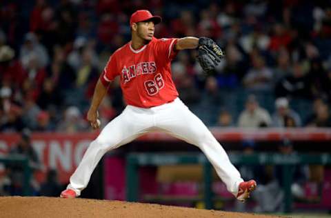 Los Angeles Angels relief pitcher JC Ramirez throws in the eighth inning against the Seattle Mariners. Mandatory Credit: Gary A. Vasquez-USA TODAY Sports