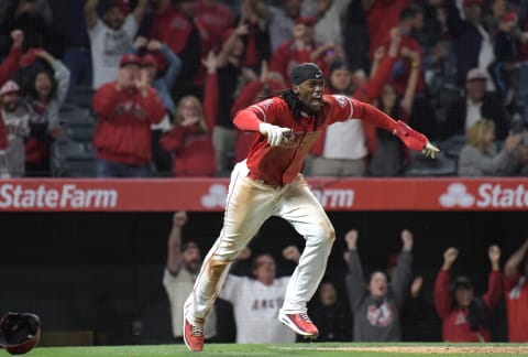 Los Angeles Angels left fielder Cameron Maybin celebrates after scoring the winning run in the 10th inning against the Texas Rangers. Mandatory Credit: Kirby Lee-USA TODAY Sports