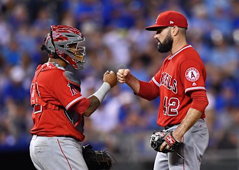 Los Angeles Angels pitcher Matt Shoemaker gets a fist pump from catcher Martin Maldonado before getting relieved against the Kansas City Royals during the sixth inning. Mandatory Credit: Peter G. Aiken-USA TODAY Sports