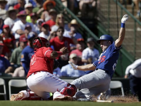 Chase Utley gets tagged out by Los Angeles Angels catcher Martin Maldonado trying to score in the fourth inning during a spring training game. Mandatory Credit: Rick Scuteri-USA TODAY Sports