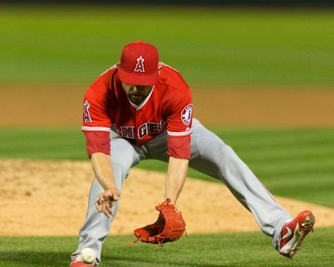 Angels starting pitcher Ricky Nolasco fields a ground ball against the Oakland Athletics. Mandatory Credit: Neville E. Guard-USA TODAY Sports