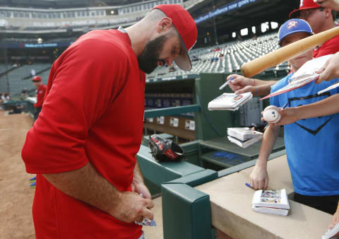 Los Angeles Angels starting pitcher Matt Shoemaker signs autographs for fans before a game against the Texas Rangers. Mandatory Credit: Jim Cowsert-USA TODAY Sports